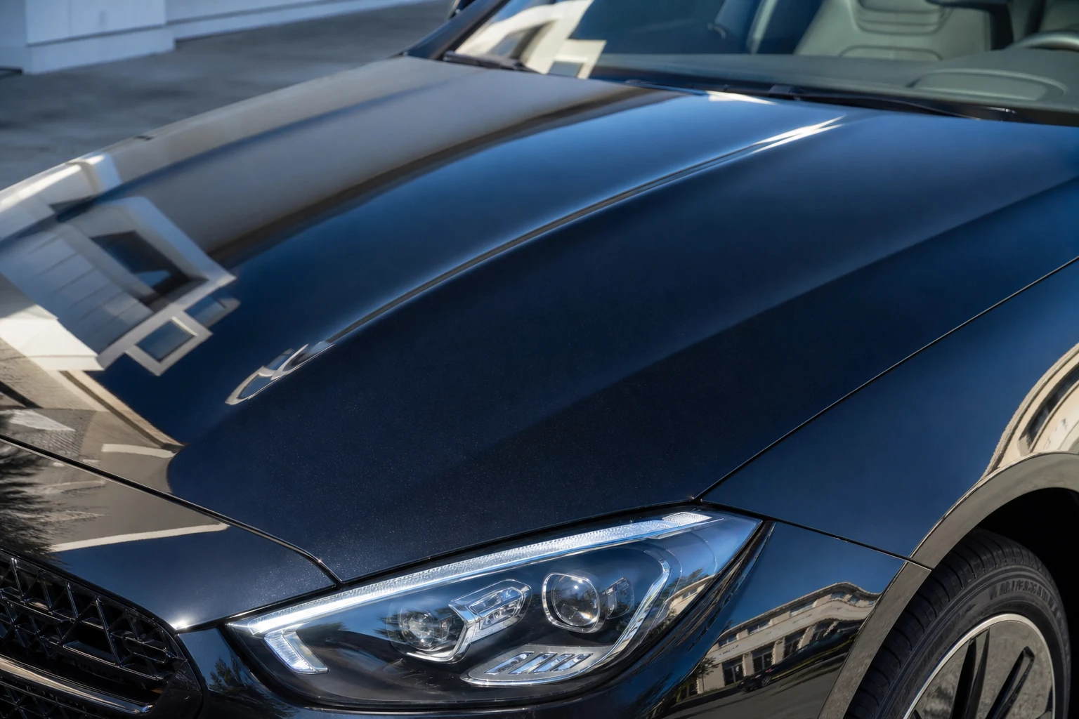 Luxury vehicle paint after correction with deeper gloss and sharper reflections