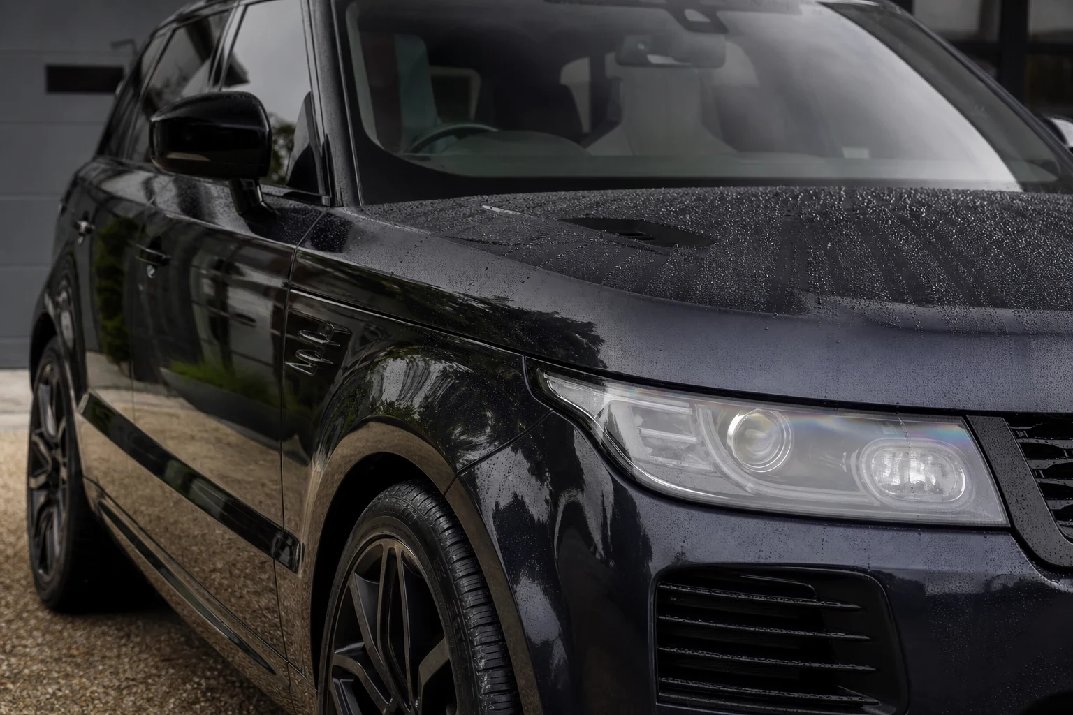 Dark car exterior with glossy finish after a careful hand wash
